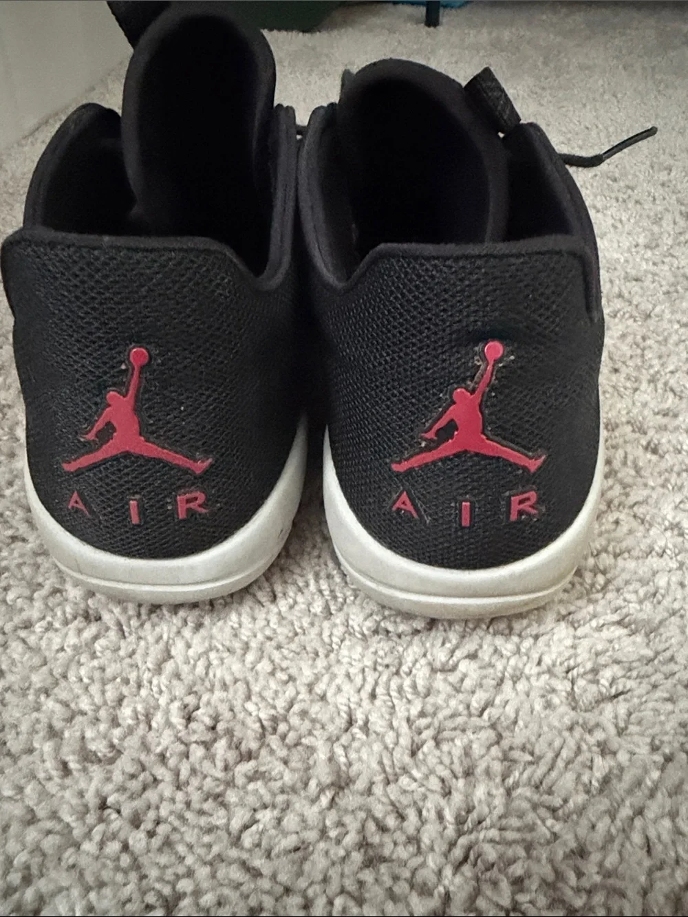 Jordan Men’s Black Sneakers with Red Jumpman Accent